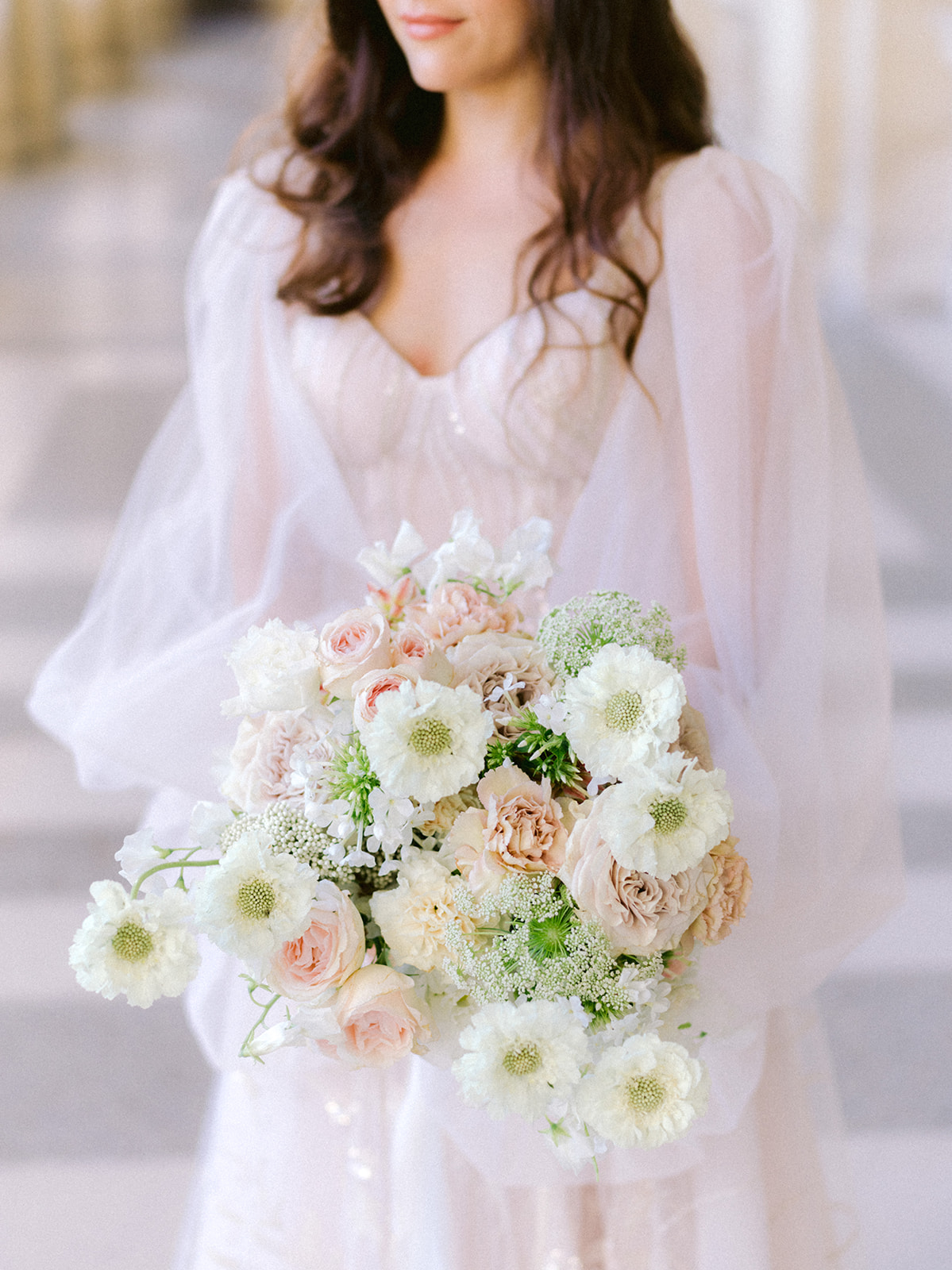 Bride holding a beautiful bouquet of flowers in her hands